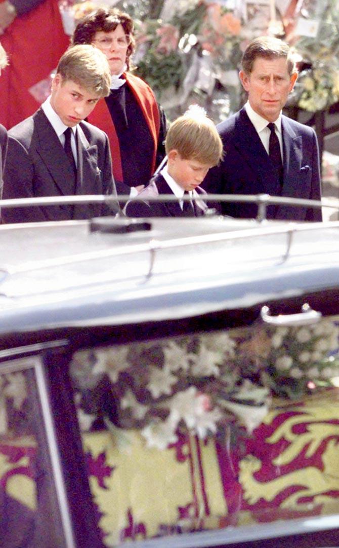 Charles at the funeral with William and Harry. Pic/AFP