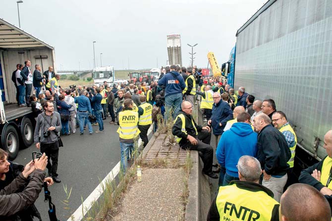 French truckers block the main routes in and out of the port of Calais to call for the closure of the “Jungle” migrant camp in Calais. Pic/AFP