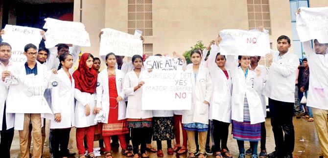 Medical students protest at AIIMS in Bhopal on Saturday. Pic/PTI