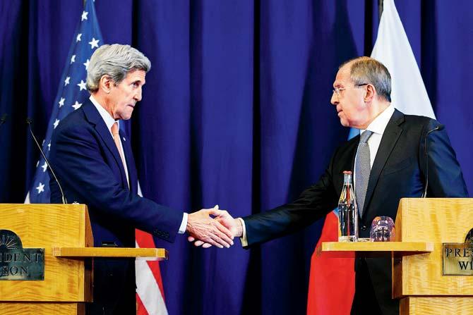 US Secretary of State John Kerry (L) and Russian Foreign Minister Sergei Lavrov shake hands at the end of a press conference closing meetings to discuss the Syrian crisis. Pic/AFP