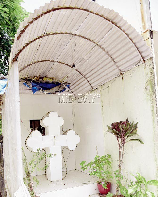 The statue before the cross at Juhu Tara Road was found broken yesterday