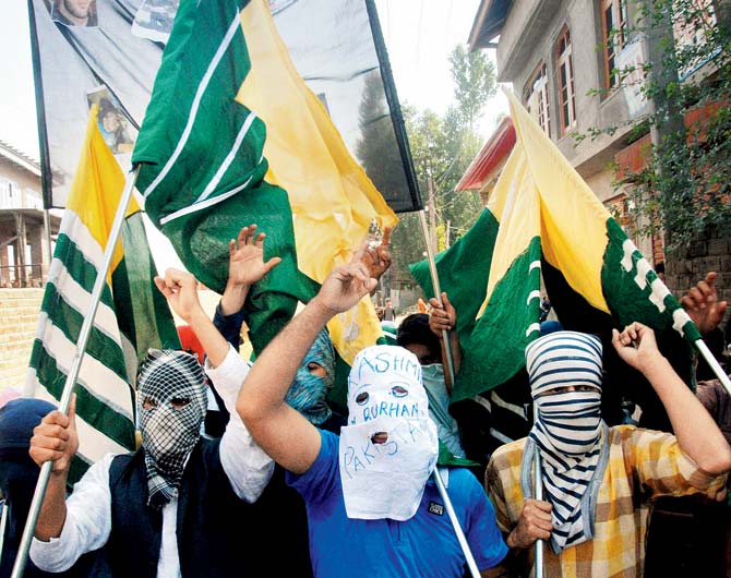 Kashmiris protest the detention of Hurriyat leader Mirwaz Umar Farooq in Srinagar on Saturday. Pic/PTI