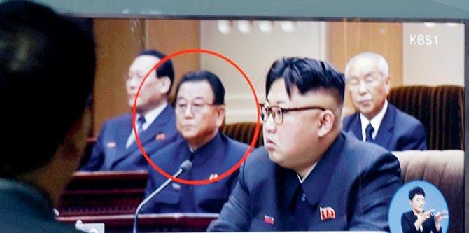 A file image of Kim Yong Jin (circled) a vice premier on education affairs in North Korea’s cabinet and Kim Jong Un. Pic/AFP