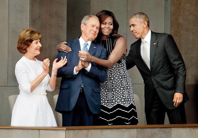 First lady Michelle Obama hugs former President George W Bush, in an image that has since gone viral. Pic/AP