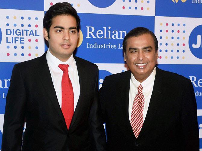 Mukesh Ambani, Chairman, Reliance Industries Ltd. with his son Akash Ambani at the company