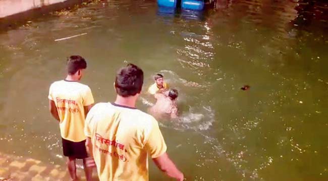 (Anti-clockwise from top) The footage shows the cop, identified as Nitin Degale, lift a Ganesh idol for immersion. He is soon approached by four men, who following an argument, push the official into the pond, and then try to drown him