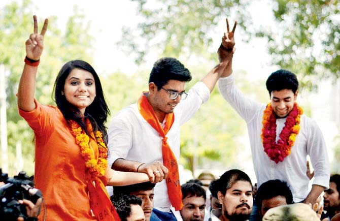 ABVP candidates Priyanka Chabri, Amit Tanwar and Ankit Sangwan celebrate their victory in the 2016 DUSU elections in Delhi. Pic/PTI