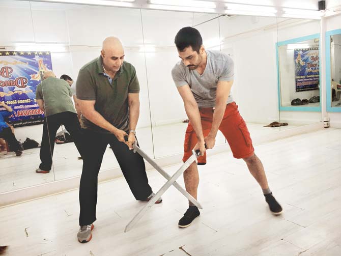 Puneet Issar rehearses a fight sequence for his upcoming play 