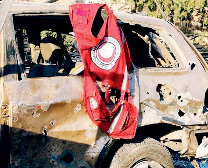 A vest of the Syrian Arab Red Crescent hanging on a damaged vehicle, in Aleppo, Syria on Tuesday. Pic/AP