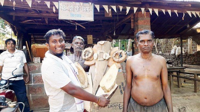 Patil holds a Ganesha carved by woodcutters of Mithbao village in Konkan, Maharashtra. Pcis/Sneha Kharabe