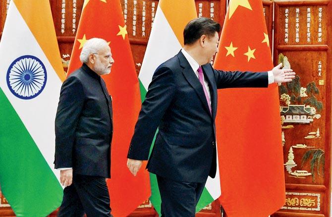 Prime Minister Narendra Modi is being shown the way by Chinese President Xi Jinping during a meeting in Hangzhou, China yesterday. Pic/PTI