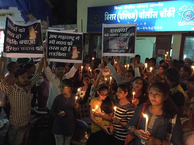 A group of residents participated in a peaceful candlelight march in front of the Virar Police Station in light of Aishwarya