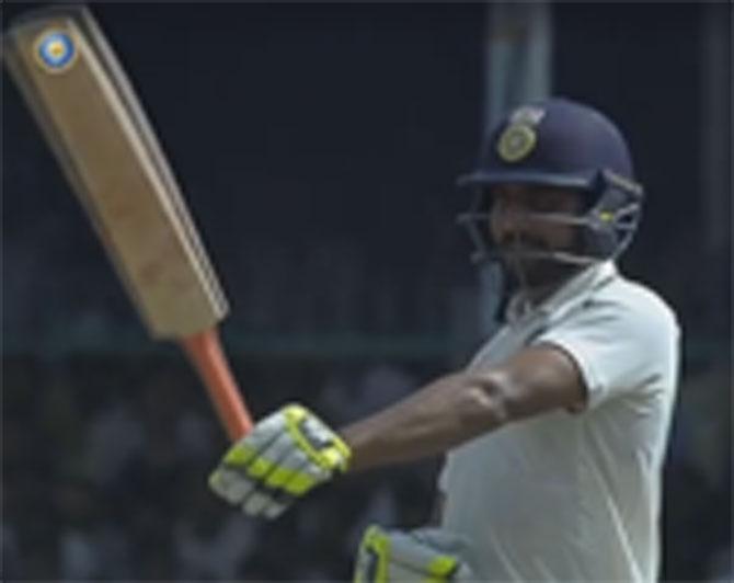 Ravindra Jadeja showing off his skills with the long blade after reaching his 50 vs the Kiwis at Kanpur