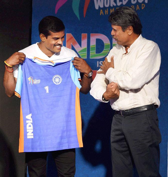 Former cricketer Kapil Dev along with Kabaddi player Dharmaraj Cheralathan during unveiling of kabaddi team jersey in Mumbai on Tuesday