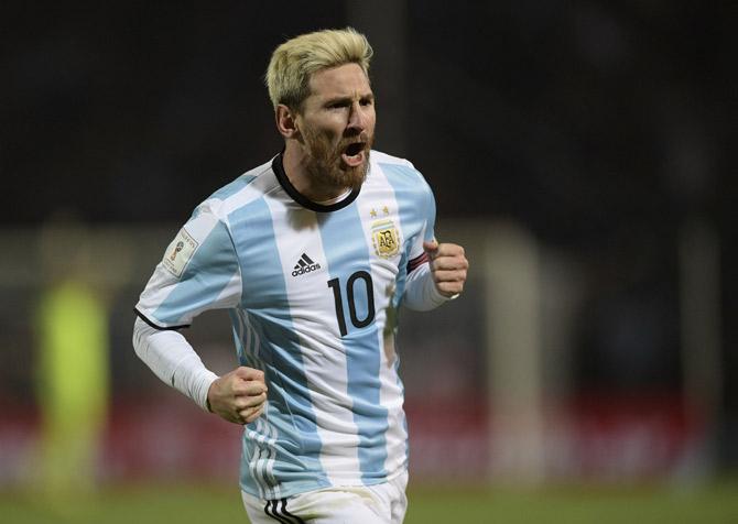 Lionel Messi celebrates after scoring against Uruguay