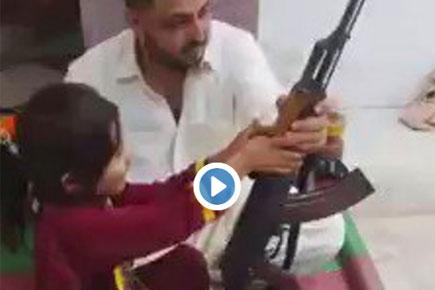Little Pak girl learning to fire AK-47 while threatening India is disturbing!