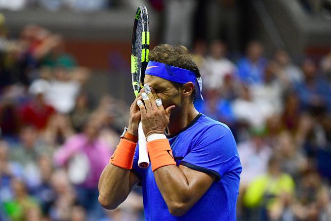 Rafael Nadal of Spain reacts against Lucas Pouille of France during his fourth round Men