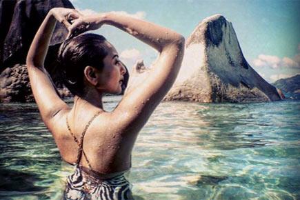 Beach babe! Sonakshi Sinha shows off her sexy back in this vacation photo
