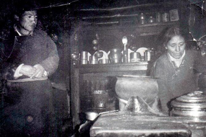 Young Rigzin Dolma prepares a meal for the family in Chansa, back in 1942