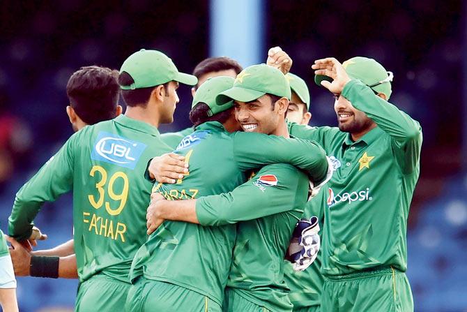 Pakistan’s Shadab Khan (centre) embraces skipper Sarfraz Ahmed after their win over West Indies in Port of Spain on Thursday. Pic/AFP