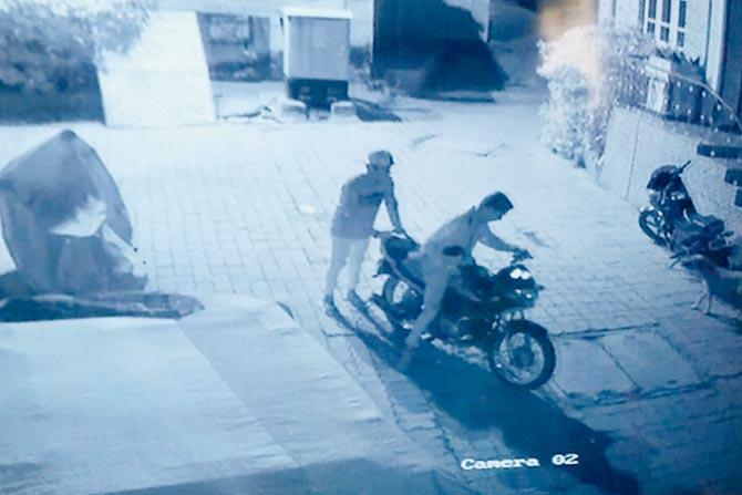 CCTV footage shows two men fleeing with the bike