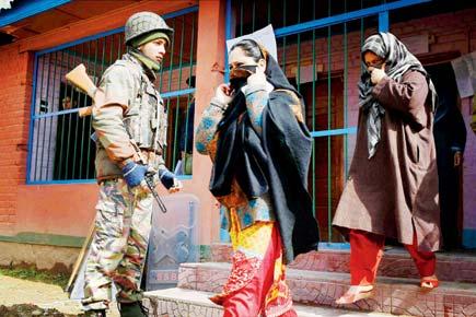 8 die in firing, as violence mars polling in Kashmir