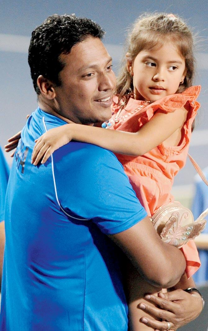 Mahesh Bhupathi with his daughter on Saturday. Pic/AFP