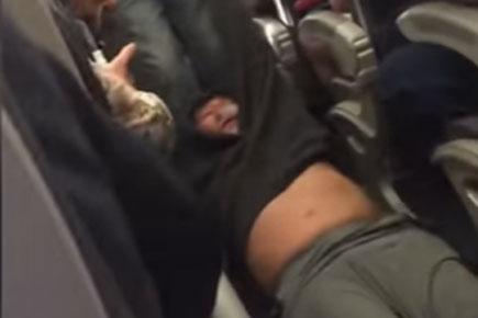 Man dragged from United Airlines flight launches legal action