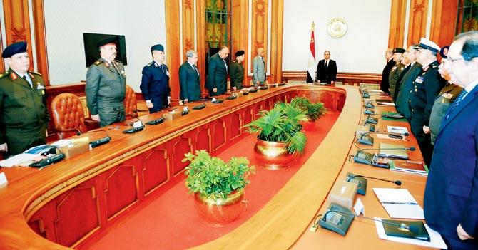 Egyptian President Abdel Fattah al-Sisi chairing a meeting of the National Defence Council before announcing the emergency
