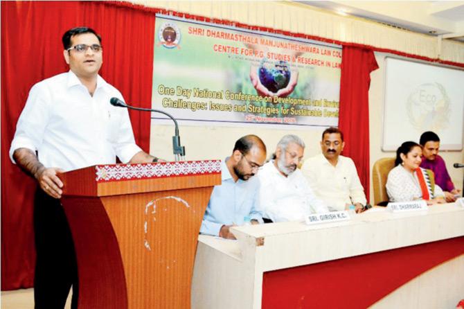 Yeshwanth Shenoy (left) speaks at a function