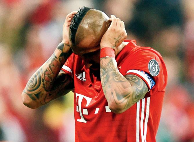 Bayern’s Arturo Vidal reacts after missing a penalty against Real Madrid on Wednesday