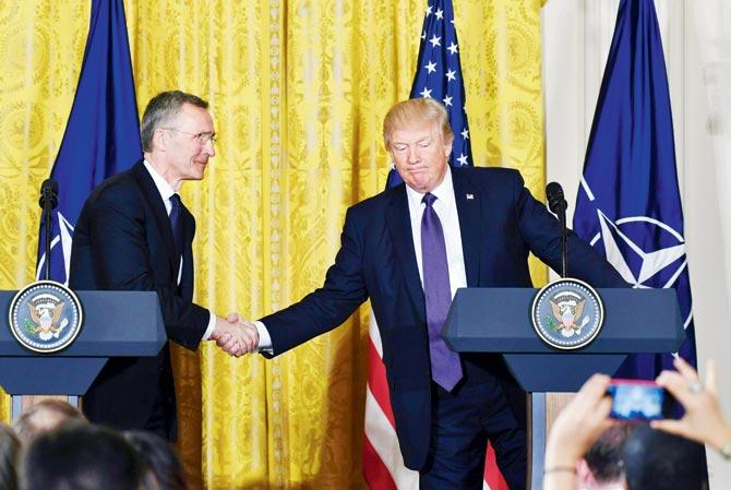 US President Donald Trump and NATO Secretary General Jens Stoltenberg shake hands during a joint press conference at the White House in Washington on Thursday. Pic/AFP