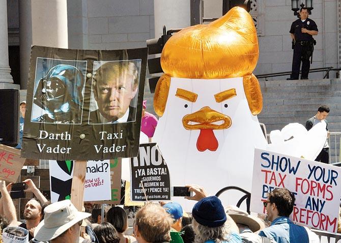 Protestors take part in the ‘Tax March’  in Los Angeles. Pic/AFP