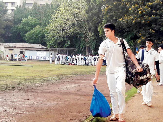 Aspiring U-19 cricketer Arjun Tendulkar walks away from the MIG Cricket Club ground in Bandra East yesterday after a wet ground forced the cancellation of Day One of the MCA trials. pic/Subodh Mayure 