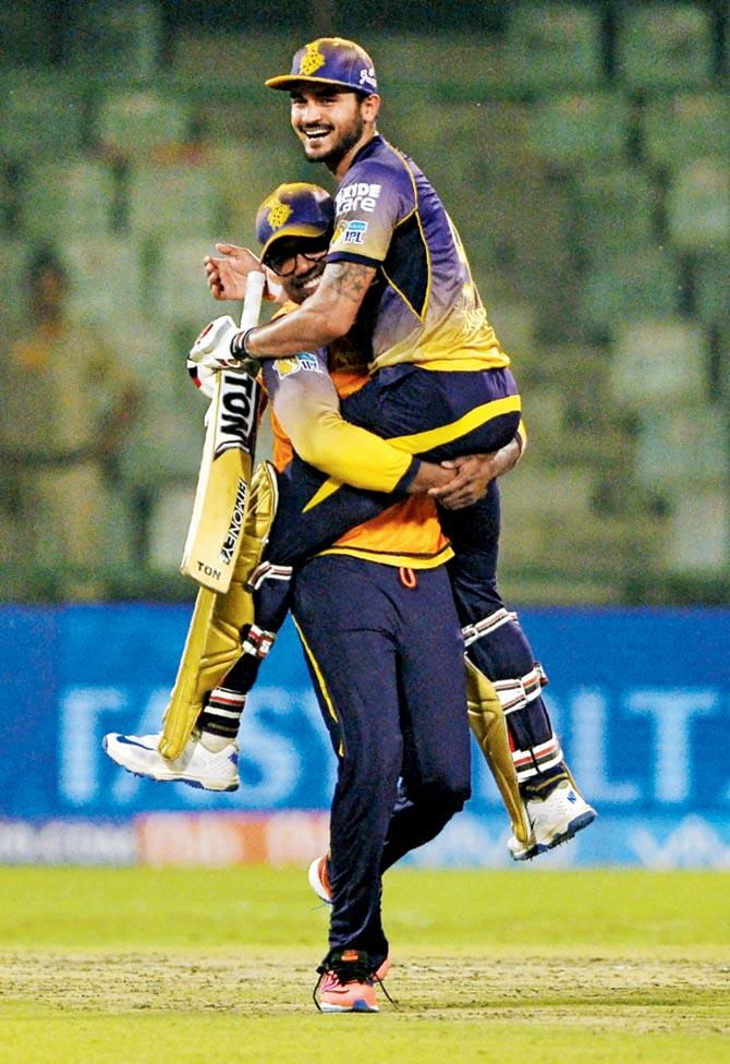 KKR’s Manish Pandey is hoisted by teammate Darren Bravo after their four-wicket victory against Kings XI Punjab in an IPL-10 encounter in New Delhi yesterday. Pic/AFP