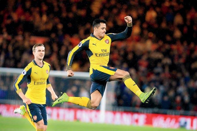 Arsenal’s Alexis Sanchez (right) celebrates his goal vs Middlesbrough during an EPL encounter on Monday. Arsenal won 2-1. Pic/AFP