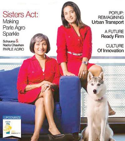 Schauna and Nadia Chauhan on the cover with their dog Akira