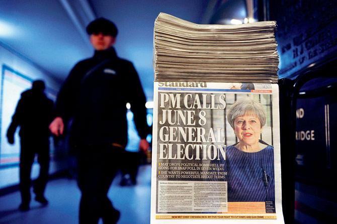 A newspaper stand shows a copy of Evening Standard, with the front page story of May’s call for a snap general election. PIC/AFP