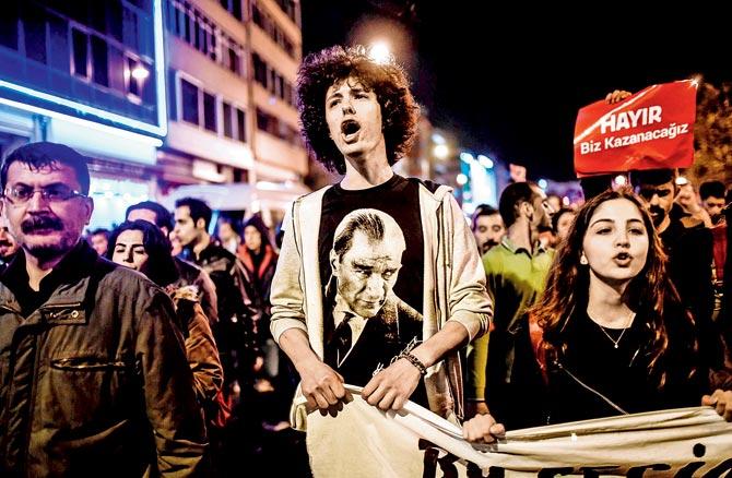 A protester gestures and chants slogans during a march at the Kadikoy district in Istanbul. Pics/AFP 