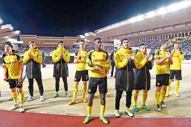 Borussia  Dortmund players applaud their fans after losing to Monaco in the Champions League quarters on Wednesday. Pic/AFP