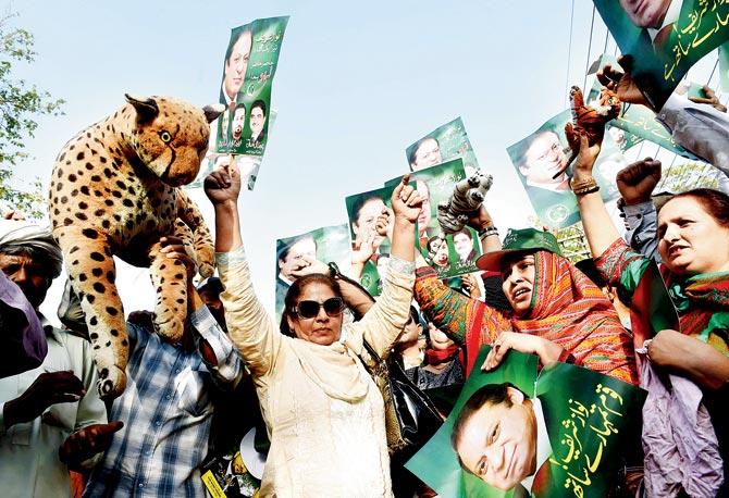 Supporters of the ruling Pakistan Muslim League-Nawaz (PML-N) celebrate at a rally after the Supreme Court verdict. Pic/AFP
