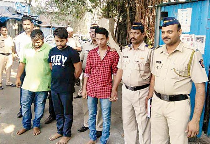 Gautam Lakhani (in green), Jaswant Singh (in black) and Bhagwan Singh (in red) after their arrest