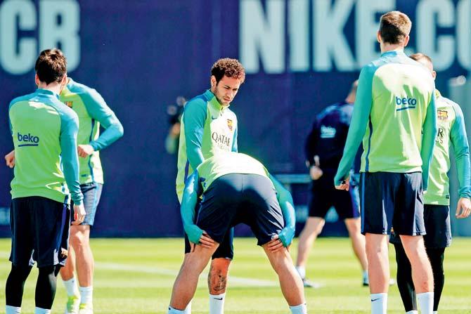 Neymar with a teammate during  a training session in Barcelona on Saturday. Pic/AFP