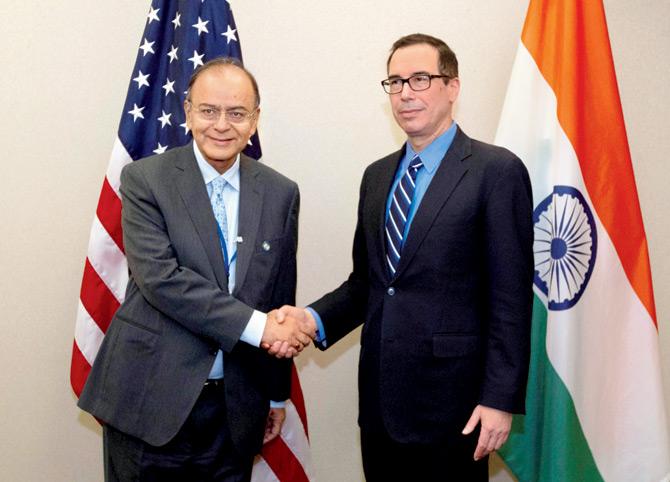 US Treasury Secretary Steven Mnuchin (right), is seen shaking hands with Finance Minister of India Arun Jaitley before a bilateral meeting during the World Bank/IMF Spring Meetings in Washington over the past weekend. Pic/AP/PTI