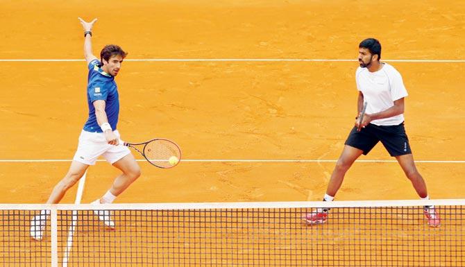 Uruguay’s Pablo Cuevas (left) returns while India’s Rohan Bopanna looks on during the Monte Carlo Masters doubles final in Monaco yesterday. Pics/Getty Images