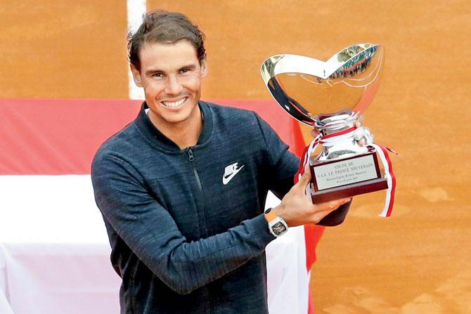 Spain’s Rafael Nadal poses with the trophy after winning the  Monte Carlo Masters final in Monaco yesterday. Pic/AFP