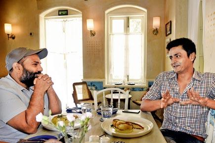 Chef Manu Chandra and cheesemaker Aditya Raghavan discuss food over coffee