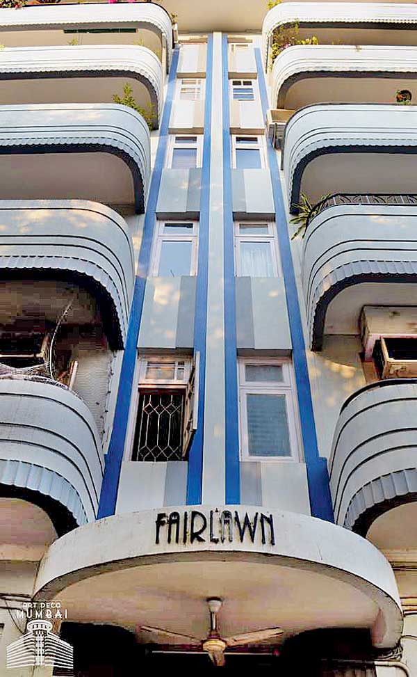 Fairlawn, a striking blue building on  M Karve Road, features sleek and curvy balconies with banding highlights and central vertical blue lines, which create a tripartite symmetry