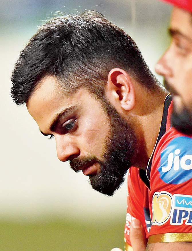 Royal Challengers Bangalore captain Virat Kohli cuts a dejected look during their IPL match vs Kolkata Knight Riders on Sunday. Pic/PTI