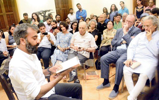 Prayaag Akbar reads from his book as columnist Anil Dharker (right) listens in. Pic/Bipin Kokate